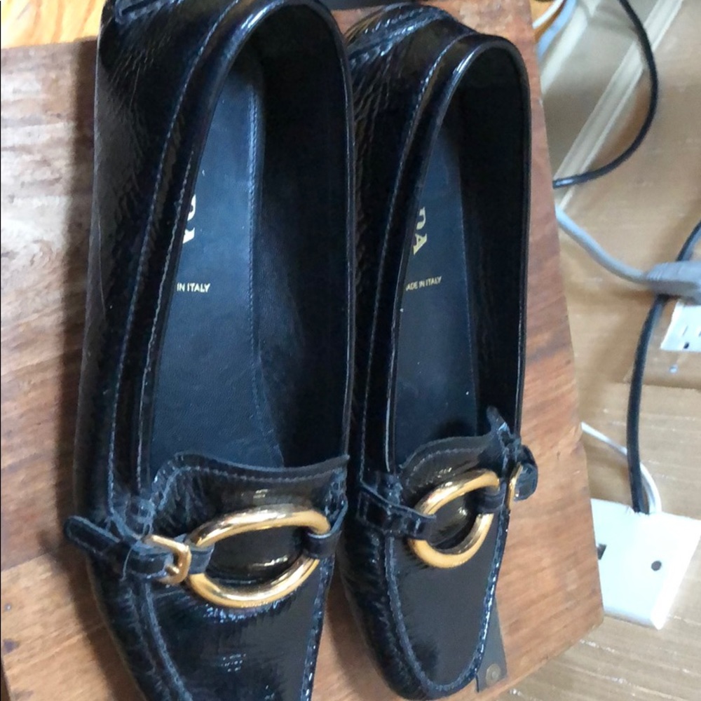 Patent leather Prada loafers w/Gold buckle